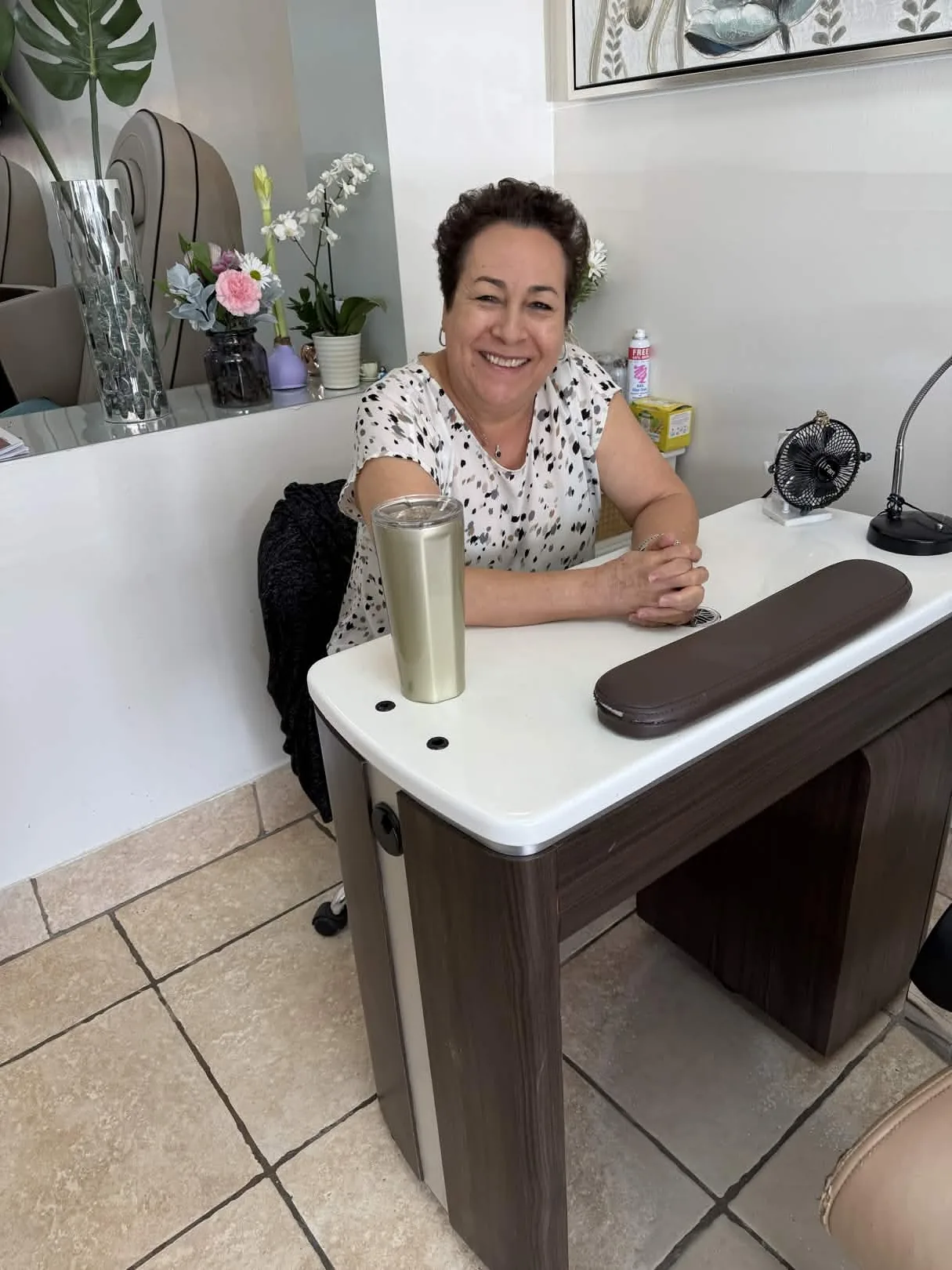 Gloria Flores, master nail artisan and La Patrona, at her manicure station inside Nails Labelle in Dallas, TX